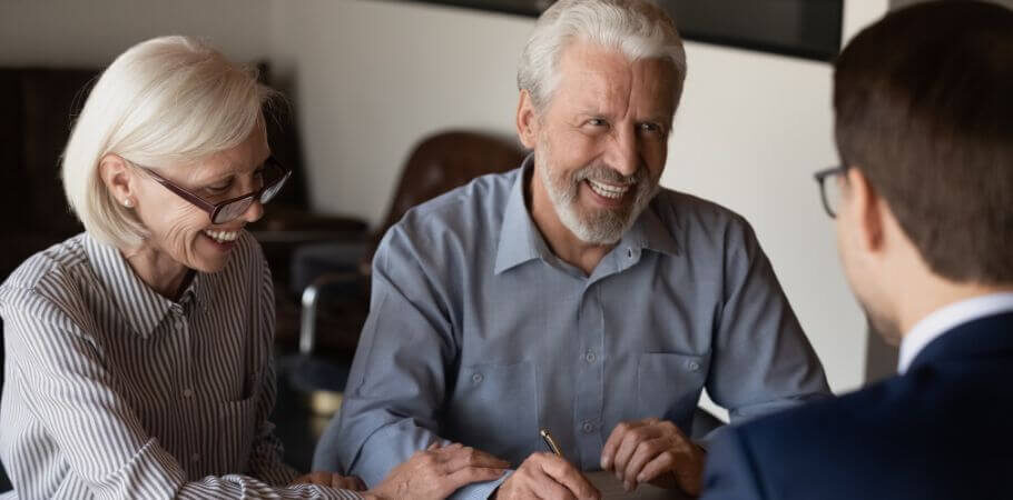 Elderly couple working with their trust planning attorney