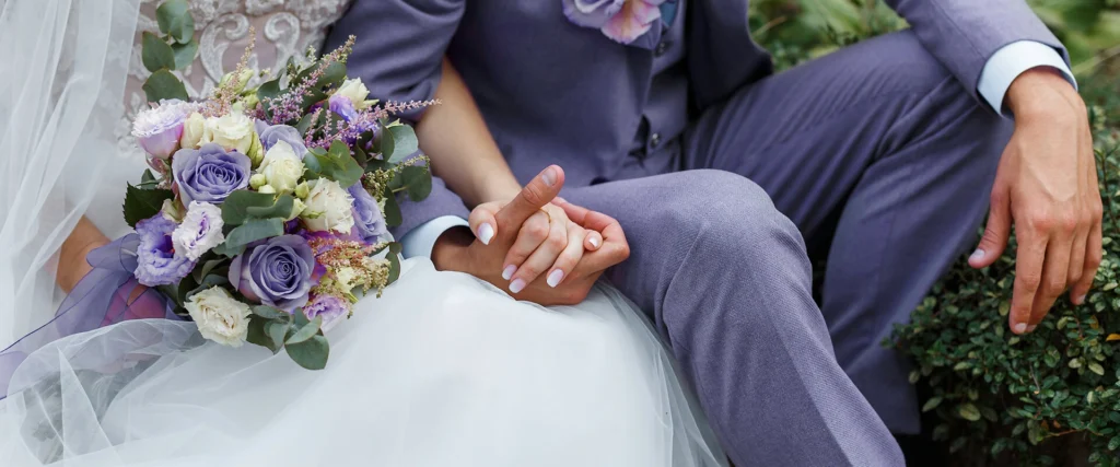 couple on wedding day holding hands
