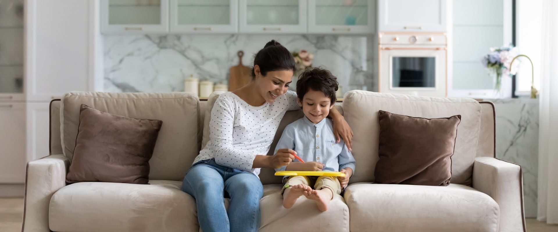 mother and son on a couch