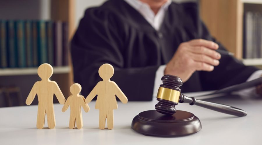 Family cardboard cut-out next to a judge