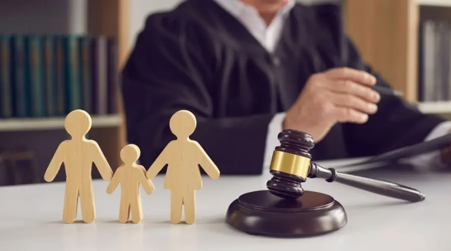 Family cardboard cut-out next to a judge