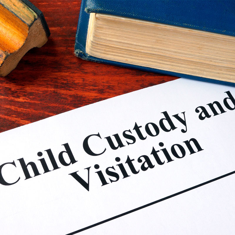 custody and visitation paperwork on a desk