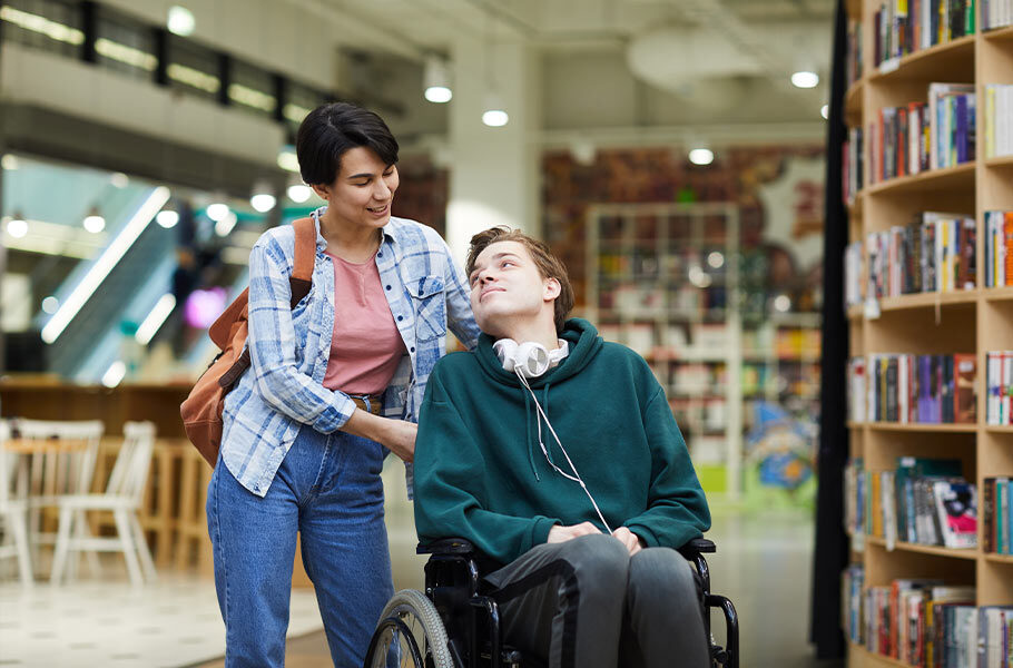 mother standing next to her special needs son