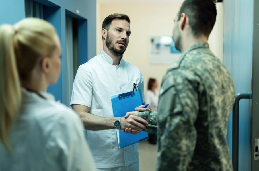 military member shaking hands with a doctor