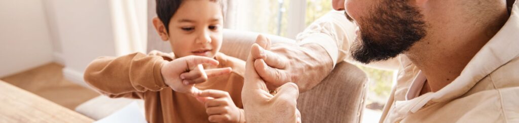 father using sign language with his son