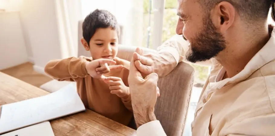 Father using sign language with his son