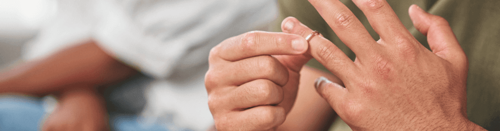 Military service member removing his wedding ring