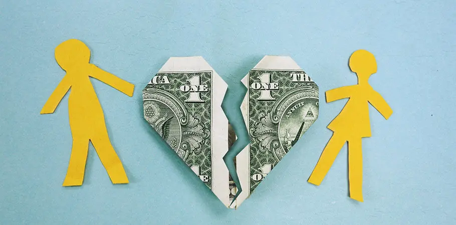 ripped dollar bill between two parents