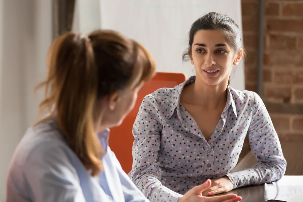 A separation attorney sitting with their client and discussing legal options.