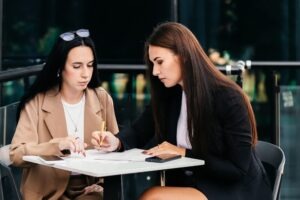 A separation lawyer in Fairfax, sitting with their client and discussing legal options.