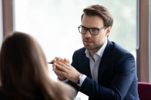 A separation attorney sitting with their client and discussing legal options.