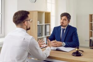 A special needs custody lawyer in Richmond, sitting with their client, discussing legal options.