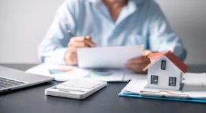 at a desk working on documents11:33 AMClaude responded: Estate planning lawyer reviewing legal documents at desk (55 chars)Estate planning lawyer reviewing legal documents at desk for client