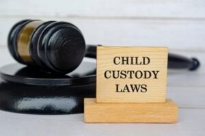 Child Custody Laws on wooden block and gavel