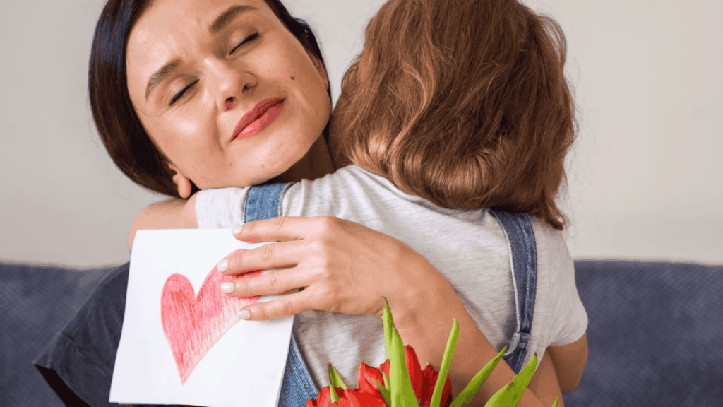 Smiling Mother hugs Child on Mothers Day