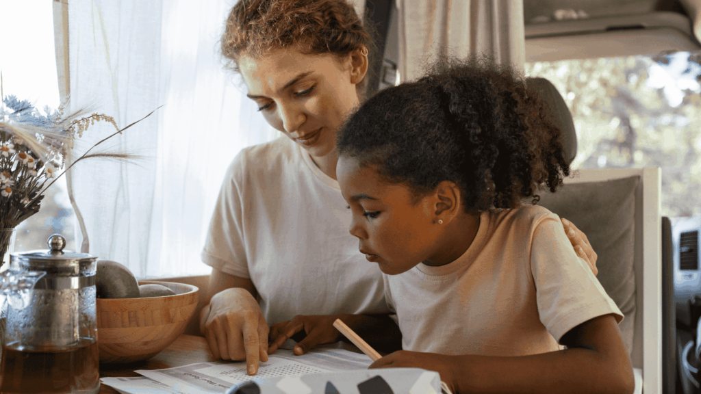Mother helps child with school homework