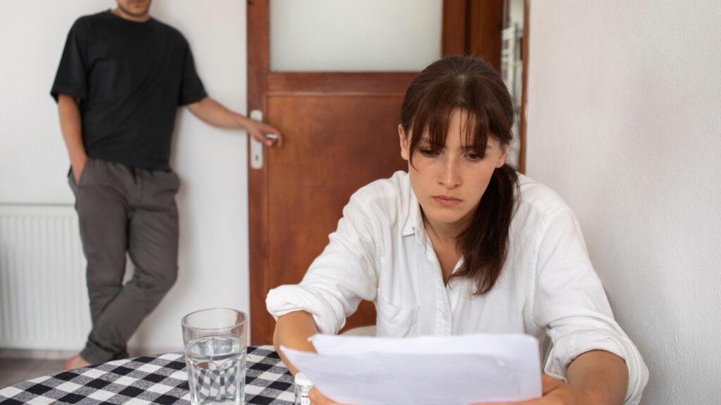 Young woman reviewing divorce documents