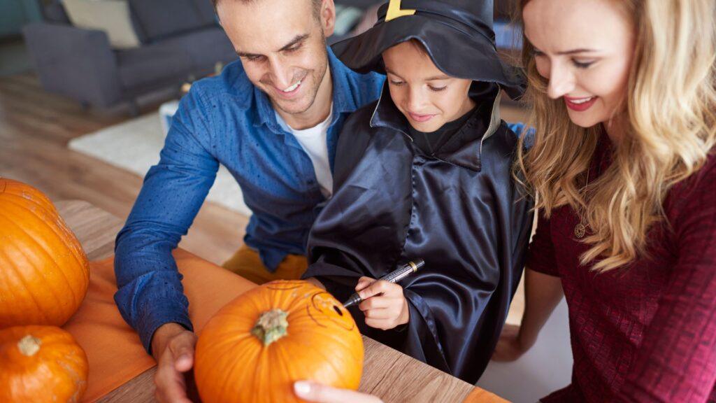 A family carving pumpkins