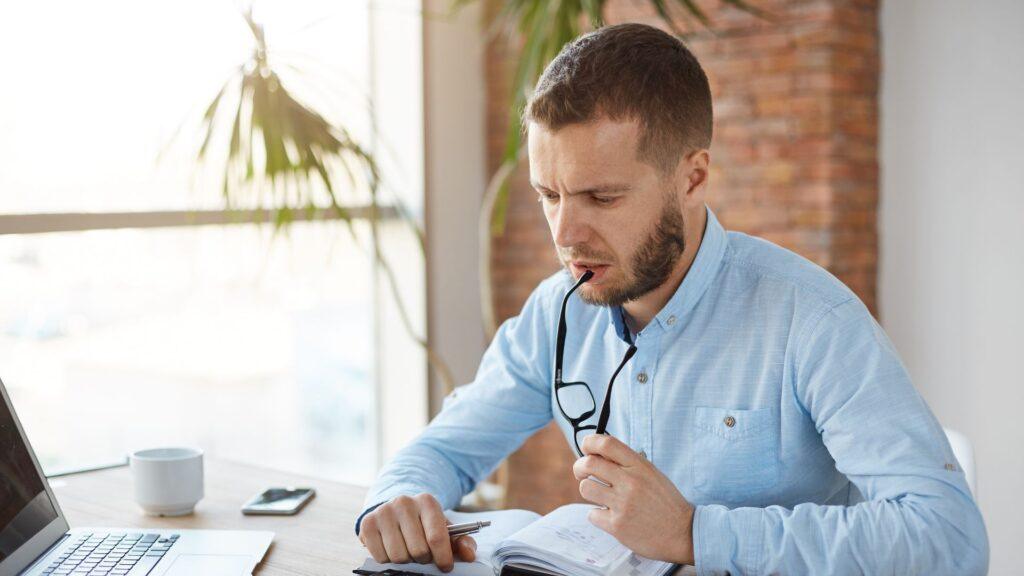 A man working on a calculator.